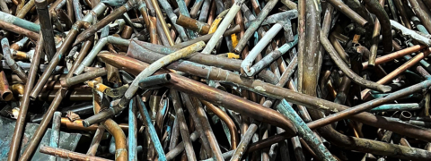 Old ferrous and non ferrous metal pipes ready to be recycled