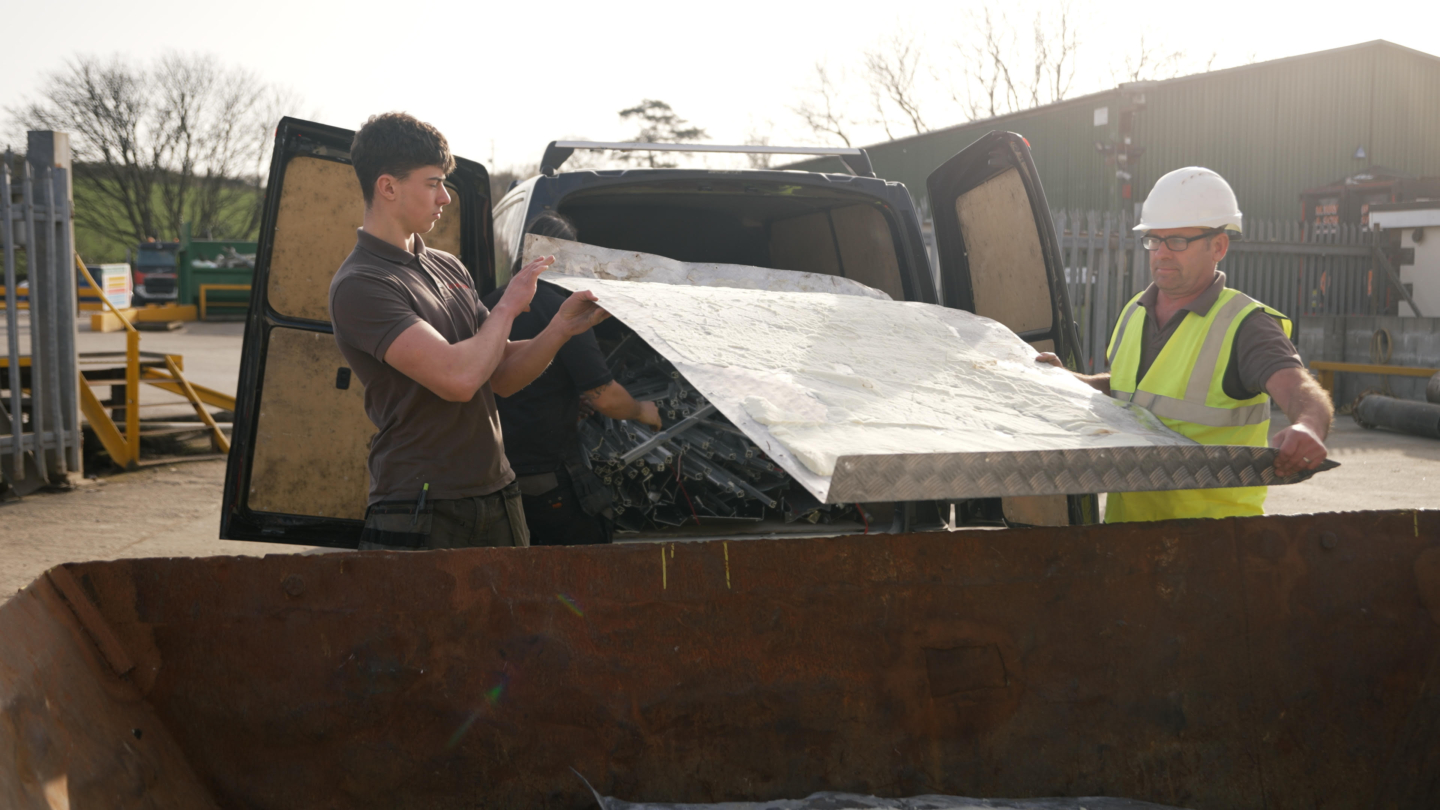 Tradesmen and agricultural recycling in action at Henry Orchard and Sons