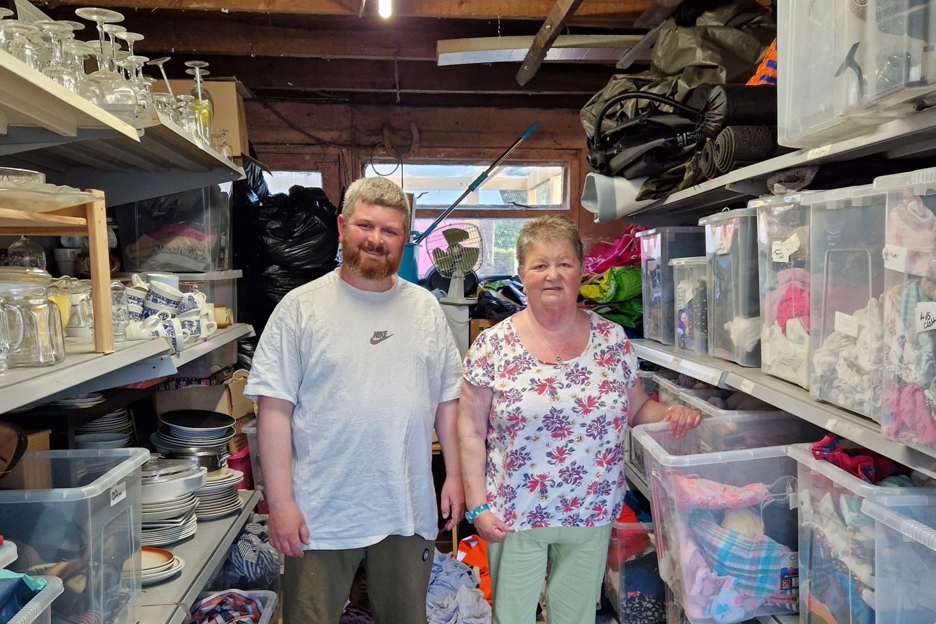 Mark and Alison Battleday in Alison's garage where donations for the Samaritans Shop are stored.